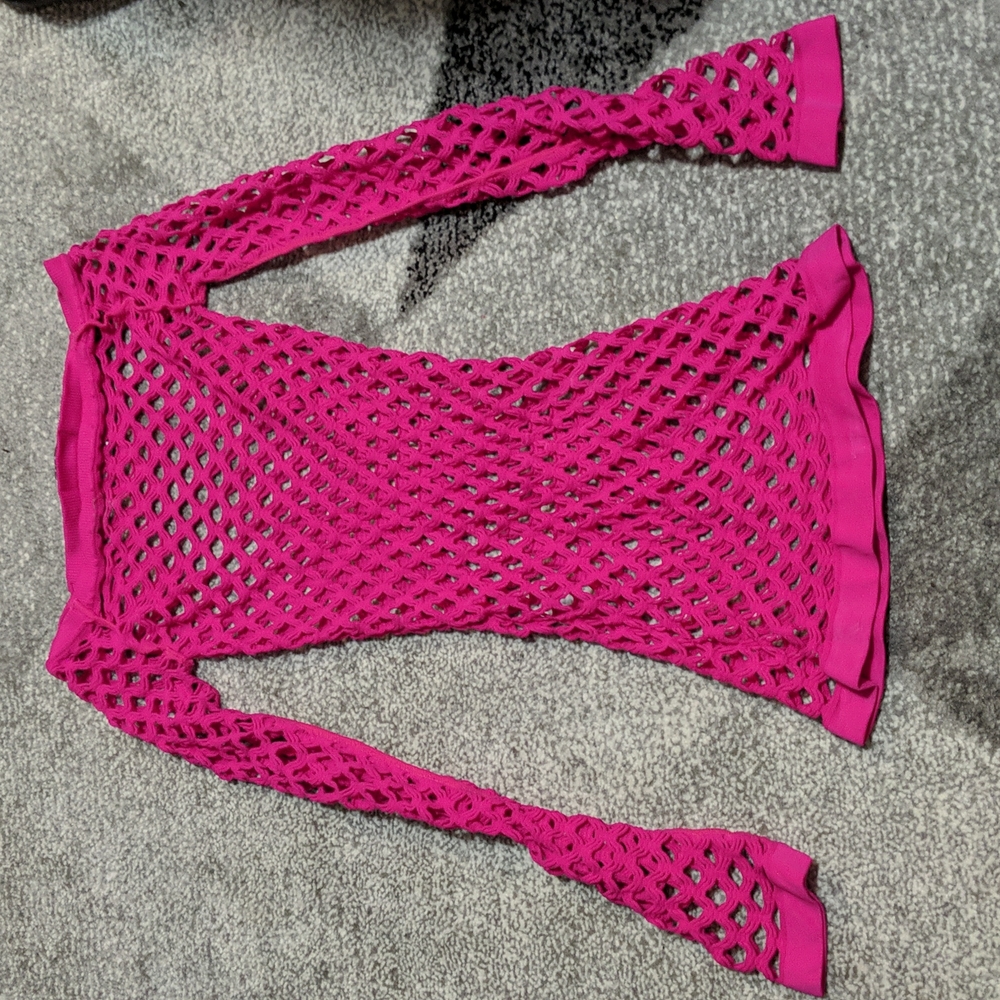 Long sleeve pink mesh top.